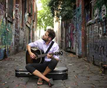 Passenger on the street with guitar