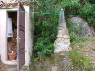 Outdoor hot shower in off-grid home in Majorca