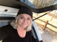 Diane inside her home-vehgicle with her hat on