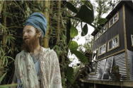 Robert Breton in front of treehouse